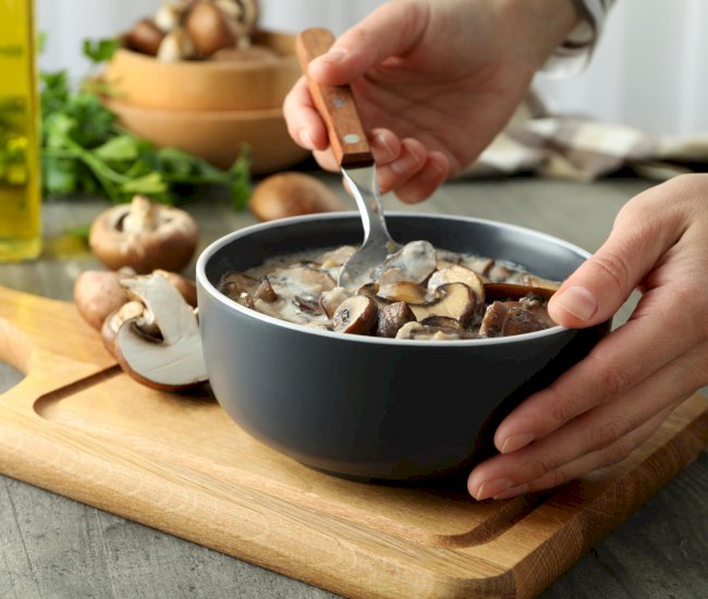 concept-tasty-food-with-mushroom-sauce-gray-textured-table